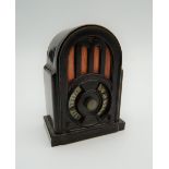 A bakelite pencil sharpener formed as a wireless. 6 cm high.