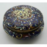 A cloisonne enamel box. 9 cm diameter.