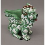 A pottery vase formed as a mythical beast. 26 cm high.