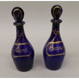A pair of early 19th century Bristol Blue glass decanters and stoppers,