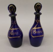 A pair of early 19th century Bristol Blue glass decanters and stoppers,