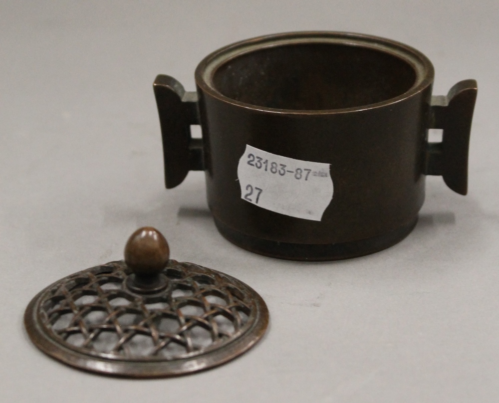 A Chinese pierced top lidded bronze censer. 6.5 cm high. - Image 2 of 3