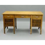 An early/mid-20th century kneehole desk. 146 cm wide. The property of Germaine Greer.