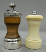 A sterling silver mounted peppermill and an early 20th century ivory peppermill. The former 10.