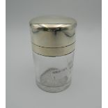 A silver topped dressing table jar. 10.5 cm high.