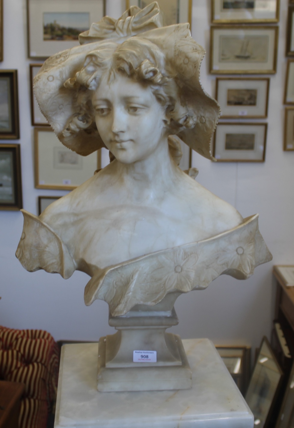 A 19th century carved alabaster bust modelled as a young lady wearing a bonnet, - Image 3 of 8