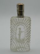 A 19th century unmarked silver topped glass scent bottle, decorated in the Mary Gregory style.