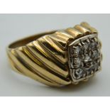 A 9 ct gold gentleman's stone set ring. Ring Size S. 6.4 grammes total weight.