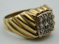 A 9 ct gold gentleman's stone set ring. Ring Size S. 6.4 grammes total weight.