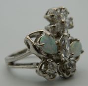 A silver cubic zirconia and opal ring. Ring Size P.