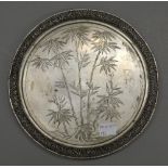A pierced and engraved Chinese silver tray, with makers mark for Tuck Chang. 21 cm diameter. 11.