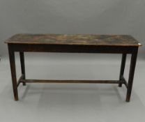 A 19th century mahogany farmhouse table. 145.5 cm long x 44 cm wide. The property of Germaine Greer.