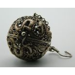 A Chinese pierced ball censer with chain for suspension. 5 cm diameter.
