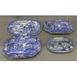 Two Victorian blue and white porcelain drainers and two plates. The largest 38 cm wide.