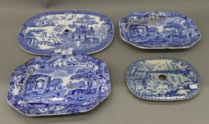 Two Victorian blue and white porcelain drainers and two plates. The largest 38 cm wide.