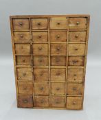 A small mahogany bank of drawers. - WITHDRAWN 51 cm high, 38 cm wide, 19 cm deep.