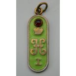 An enamel decorated silver pendant, bearing Russian marks. 4.75 cm high.