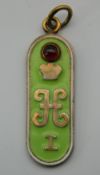 An enamel decorated silver pendant, bearing Russian marks. 4.75 cm high.