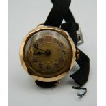 A ladies 9 ct gold cased wristwatch. 13.2 grammes total weight.