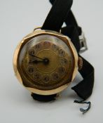 A ladies 9 ct gold cased wristwatch. 13.2 grammes total weight.