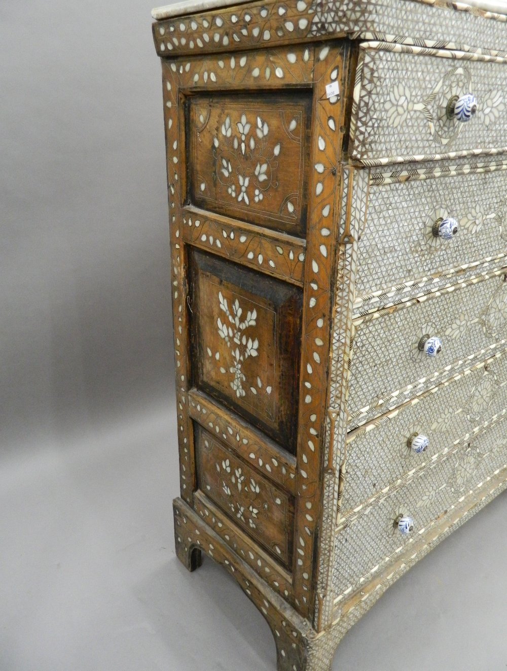 A Syrian mother-of-pearl inlaid chest of drawers with associated marble top. - Image 9 of 25