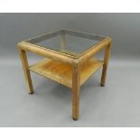 An Art Deco glass topped coffee table. 56.5 cm wide. The property of Germaine Greer.
