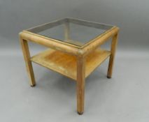 An Art Deco glass topped coffee table. 56.5 cm wide. The property of Germaine Greer.