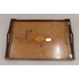 An Edwardian mahogany tray inlaid with a cypher. 47.5 cm wide.