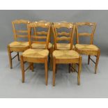 A matched set of six Victorian rush seated country chairs. 39 cm wide.