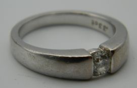 An 18 ct white gold diamond solitaire ring. Ring Size K/L. 6.1 grammes total weight.