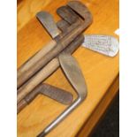 A quantity of vintage golf clubs