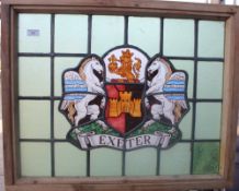 A leaded stained glass panel bearing the Exeter Coat of Arms. 75 cm wide.
