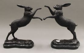 A pair of boxing hares. 30 cm high.