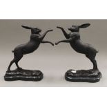 A pair of boxing hares. 30 cm high.