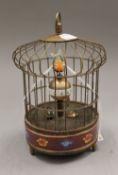 A cloisonne birdcage clock. 20.5 cm high.