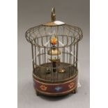 A cloisonne birdcage clock. 20.5 cm high.