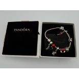 A boxed Pandora bracelet. Approximately 17 cm long.