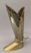 A brass boot form stick stand. 52 cm high.