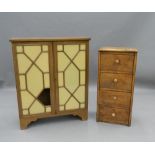 A small early 20th century oak bank of drawers and a glazed mahogany cabinet. The former 81 cm high.