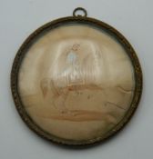 A 19th century framed miniature depicting a soldier on horseback. 7 cm diameter.