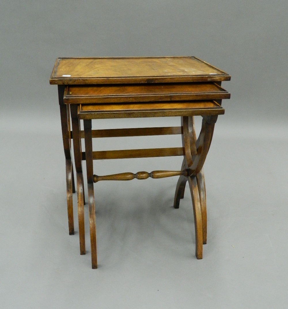 A nest of three mahogany tables. 56 cm wide. - Image 2 of 7