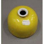 A Chinese yellow porcelain brush pot. 8 cm high.