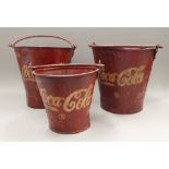 A set of Coca-Cola buckets