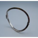 A Contemporary silver bangle. 10.5 grammes.