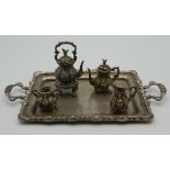 A miniature sterling silver tea set and tray. The tray is 16 cm wide. 179 grammes.