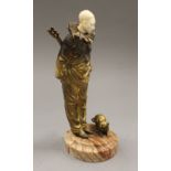 An early 20th century ivory mounted gilt bronze model of a clown and a cat. 22.5 cm high.