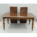 A reproduction mahogany two-leaf extending dining table. 160 cm long extended.