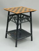 A lacquered bamboo games table. 50.5 cm wide. The property of Germaine Greer.