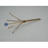A 9 ct gold champagne swizzle stick. 8.4 grammes total weight.
