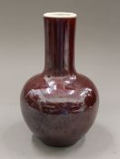 A Chinese red porcelain vase. 23 cm high.
